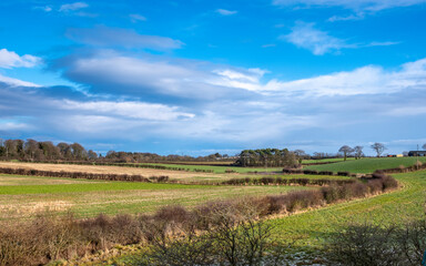 Fototapeta na wymiar Beautiful Scottish Farmlands with farming fields the heart of Burns country at Perceton Mains between Stewarton and Irvine in Scotland.