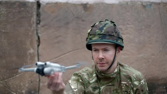 Army Man Launches Drone For Tactical Surveillance