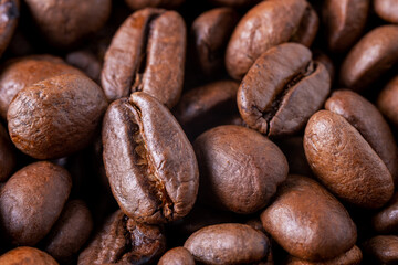 Close-up of roasted coffee beans as background. Selective focus.