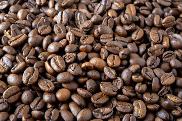Roasted coffee beans background. Selective focus.