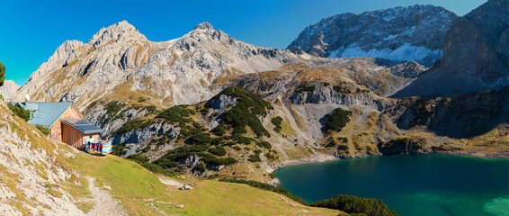 idyllic alpine lake Drachensee and mountain hut, Mieminger Alps austria