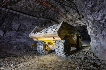 Fototapeta Dump truck filled with ore underground at a mine in Australia obraz