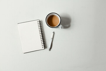 Flat Lay Minimalistic Blank Notepad with Pen and Coffee - White Background and Shadows