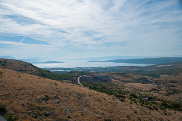 The hillside by a bay of water near Split, Croatia on a sunny day