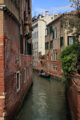 Fototapeta na wymiar Little canal of Venice on a May afternoon.