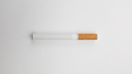 Cigarettes on a white background. A strong passion for smoking. Harmful to health. Smoking can be harmful to your health. It's a pity for the environment. Health problem, causes cancer. Cigarette