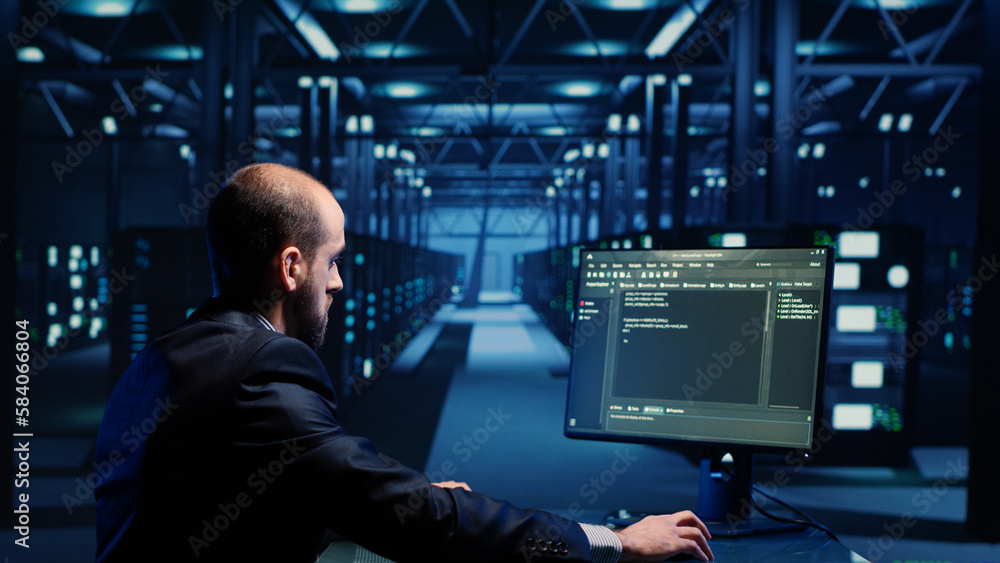 Poster network engineer doing hardware check on computer in server room, working with data protection for c