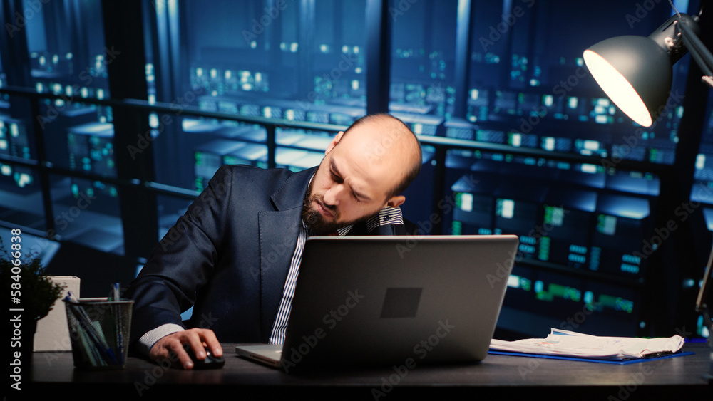 Poster information security officer finishing digitalization work in professional data center with mainfram