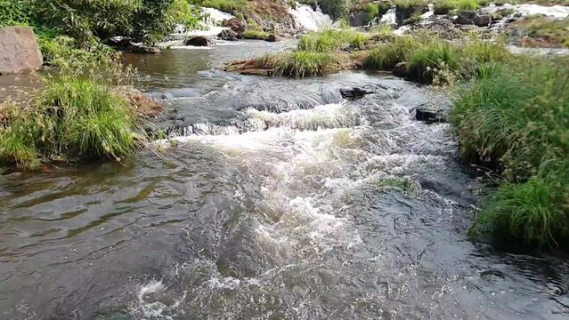 the water of the river flowing over rocks, lobe falls kribi Cameroon