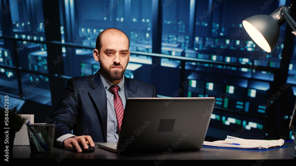 Poster server technician specialist working on laptop running networking diagnostics on cyber security rack