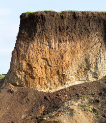 Sedimentary rocks with a high content of iron oxide. Red soil, loam. The texture of the soil.