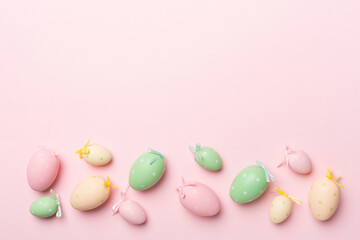 Fototapeta na wymiar Cute easter eggs on color background, top view