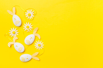 Cute easter bunnies on color background, top view