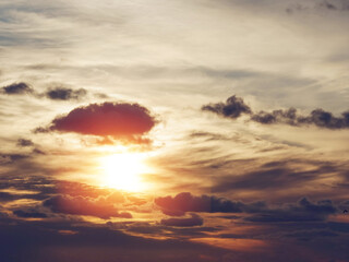 Dark dramatic sunset sky with white clouds. Background for design purpose and sky replacement.