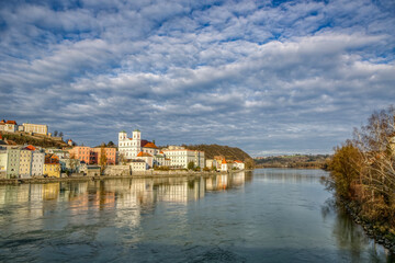 Fototapeta na wymiar High dynamic range cityscape view of Passau city with view at the river inn in late afternoon sunlight in march