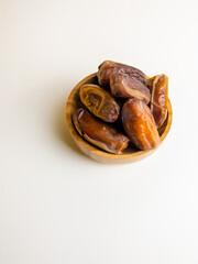 close up view of kurma, tunish dates isolated on white background