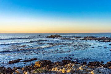 Calm sea water at dusk on the coast of Monterey Bay in California