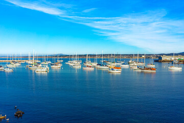 Boats marooned in the outer harbor in Monterey, California
