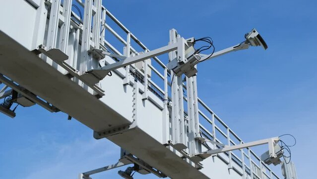 Close-up Of Security Camera On The Street. Multi-angle CCTV on pillar 360 degree system background blast cipping path operating over the road monitoring system of blue sky. Technology concept