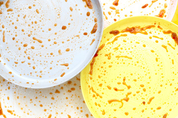 Dirty dishes on yellow background. Top view