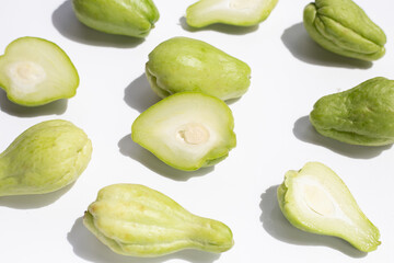 Fresh chayote fruit on white background.