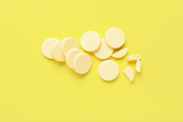 Soluble tablets on yellow background