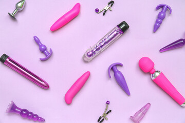 Different sex toys on lilac background