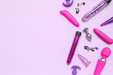 Different sex toys on lilac background