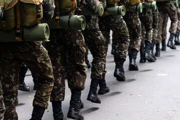 Army soldiers standing with war gear are seen during the Brazilian independence day parade.