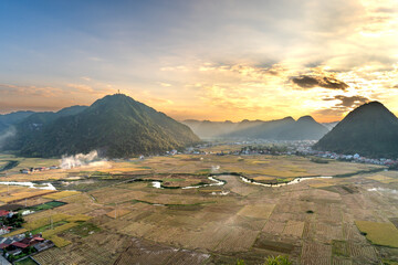 Panoramic view of Bac Son valley with yellow rice fields in harvest season in Bac Son district, Lang Son province, Vietnam