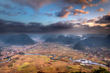 Dawn on Bac Son valley during the ripe rice season. View from the top of Na Lay mountain, Bac Son district, Lang Son province, Vietnam