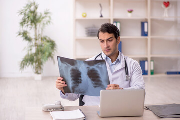 Young male doctor radiologist working in the clinic