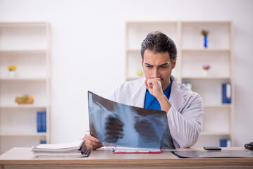 Young male doctor radiologist working in the clinic