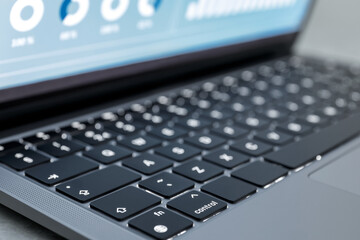 Laptop on light grey background, closeup. Modern technology