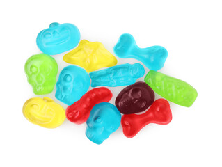 Delicious colorful candies on white background, top view. Halloween sweets