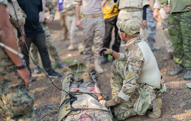 Team of U.S. Army marine corps soldier military war with gun weapon rescue and help friends from the enemy during Cobra Gold in battle. Combat force training.