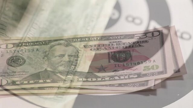 Animation of hand counting american dollar bills spinning over bull's eye