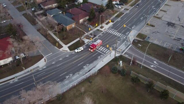 Aerial View Of Fire Engine Truck Responding And Driving In The Road.