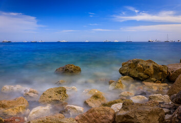 Fototapeta na wymiar Mediterranean Sea and a pebble beach, Roquebrune Cap Martin, France near Monaco