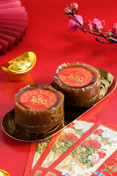 nian gao or chinese new year cake in red background. popular in Indonesia as kue bakul or kue keranjang.