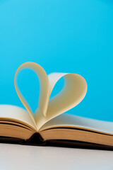 Book pages curved into heart shape