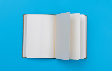 Open book on blue background
