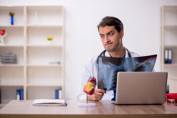 Young male doctor radiologist working in the clinic