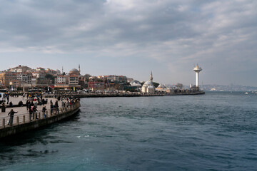 View of the Uskyudar district in the Asian part of Istanbul and the Shemsi Ahmed Pasha Mosque from the Bosporus water area on a sunny day, Istanbul, Turkey