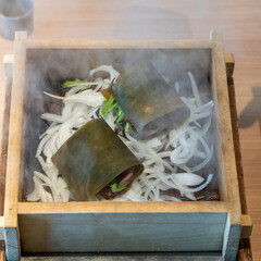 Steamed Japanese beef sandwiched between sheets of kelp