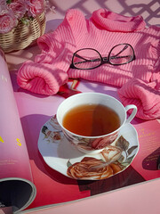 still life a cup of tea, sweater and flower
