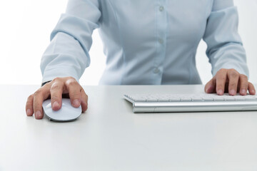 Woman hand tying on computer keyboard