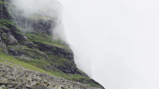 Clouds And Fog Moving On Rocky Cliff Of Lovund Island In Norway. - static