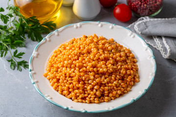 Couscous pilaf with tomatoes. Turkish name; domatesli kuskus pilavi