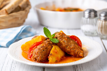 Traditional Homemade Turkish Food Kofte - Kofta with Tomato Sauce and Potatoes. (Turkish name; Izmir kofte)